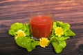 Glass of tomato juice on wooden table, closeup. Royalty Free Stock Photo