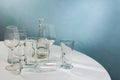 Glass transparent barware stands on a white table. Royalty Free Stock Photo