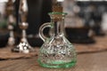 Glass transparent carafe with cork on served table. Front view. New Royalty Free Stock Photo