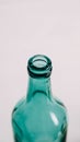 Glass transparent green bottle for liquids without the cap on a white background Royalty Free Stock Photo