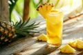 Glass with tropical non-alcoholic cocktail with pineapple juice. AI generated. Royalty Free Stock Photo