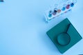 The glass tube of science, many test tubes containing colorful liquids, a magnifying glass and a book on the laboratory table Royalty Free Stock Photo