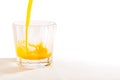 A glass tumbler is being filled with freshly squeezed Florida orange juice Royalty Free Stock Photo