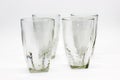 Glass tumblers on white background with selective focus ,