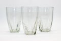 Glass tumblers on white background with selective focus ,