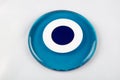 Glass Turkish eye on white background Evil eye amulet protect from bad things using by turkish culture