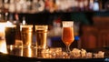 glass of unfiltered draft golden beer on bar counter with ice Royalty Free Stock Photo