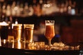 glass of unfiltered draft golden foam beer with on the bar counter