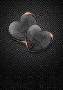 Glass valentine hearts over dark metal background