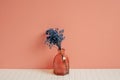 Glass vase of blue gypsophila flowers on white table. pink wall background. home decor Royalty Free Stock Photo