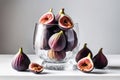 Ripe figs in a glass vase on a white table. Seasonal fruit harvest Royalty Free Stock Photo