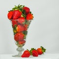 Glass vase full of fresh strawberries, healthy food