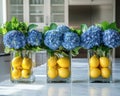 Glass vases hold vibrant blue hydrangeas and fresh lemons, citrus freshness creating fresh, bright, and creative kitchen Royalty Free Stock Photo