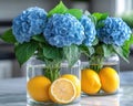 Glass vases hold vibrant blue hydrangeas and fresh lemons, citrus freshness creating fresh, bright, and creative kitchen Royalty Free Stock Photo