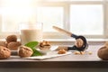 Glass of vegetable milk of walnuts on bench window background