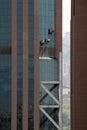 Glass of very tall buildings and skyscrapers in Turkey cleaned by professional climbers Royalty Free Stock Photo