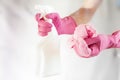 through the glass view of hand in pink glove cleaning window with sponge and spray cleaning f Royalty Free Stock Photo