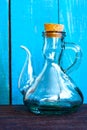 A glass vintage oiler on the blue background