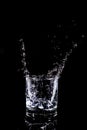 Glass of vodka splashing Royalty Free Stock Photo