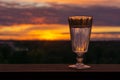 A glass of vodka on a sunset background