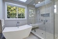 Glass walk-in shower in a bathroom of new luxury home