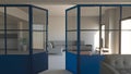 Glass wall in blue, iron and glass, living room, living space and kitchen. Modern interior design