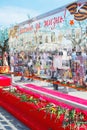 Glass wall with carnations and photographs