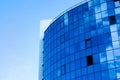 Glass wall facade with cloud sky reflection. Modern urban architecture background. Skyscraper business center, bank or hotel in