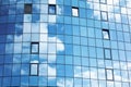 Glass wall facade with cloud sky reflection. Modern urban architecture background. Skyscraper business center, bank or hotel in Royalty Free Stock Photo