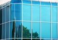 Glass wall of modern building with curved corners Royalty Free Stock Photo