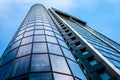 Glass wall of skyscraper, blue sky Royalty Free Stock Photo
