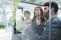 Glass wall, teamwork and business people planning, strategy and brainstorming in office workplace. Sticky notes, board Royalty Free Stock Photo