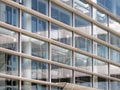 Glass wall with windows of office building in modern high-tech style design Royalty Free Stock Photo