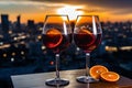 Two glasses of mulled wine close-up against the backdrop of an evening festive European city