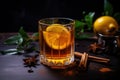 Glass of wassail or christmas winter punsh with spices and citrus on the dark background