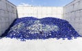 Glass waste in recycling facility. Blue bottles