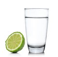 Glass of water and bergamot fruit on white background Royalty Free Stock Photo