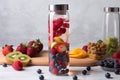 glass water bottle, filled with refreshing fruit-infused water for easy and healthy hydration