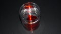 A glass of water with a decomposing red color Royalty Free Stock Photo
