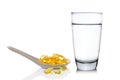 Glass of water and fish oil Royalty Free Stock Photo