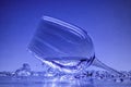 Glass in water, glass is frozen in ice, blue background Royalty Free Stock Photo