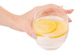 Glass of water with lemon female hands isolated