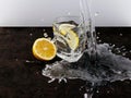 glass of water, lemon and ice cubes, on a black background. Royalty Free Stock Photo