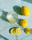 Glass of water and lemons. Summer time. Drink background.