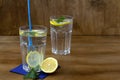 Glass of water with lime.summer drinks. two glasses of lemonade with lemon and fresh leafs mint Royalty Free Stock Photo