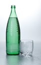 Glass of water near bottle