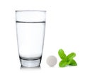 Glass of water pills and mint on white background Royalty Free Stock Photo