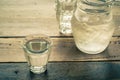 Glass of water and pitcher glass on wooden table. Royalty Free Stock Photo