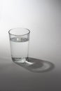 Glass of water with shadow Royalty Free Stock Photo