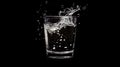 A glass of water with splashes, showcasing freshness and hydration Royalty Free Stock Photo